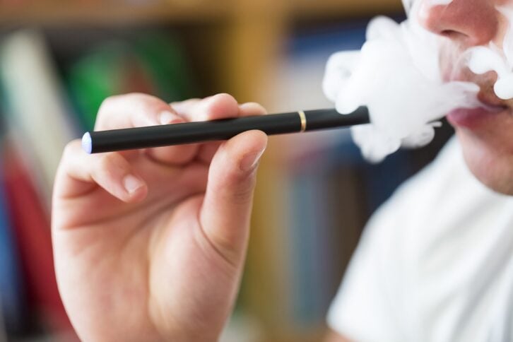 man smoking e-cig