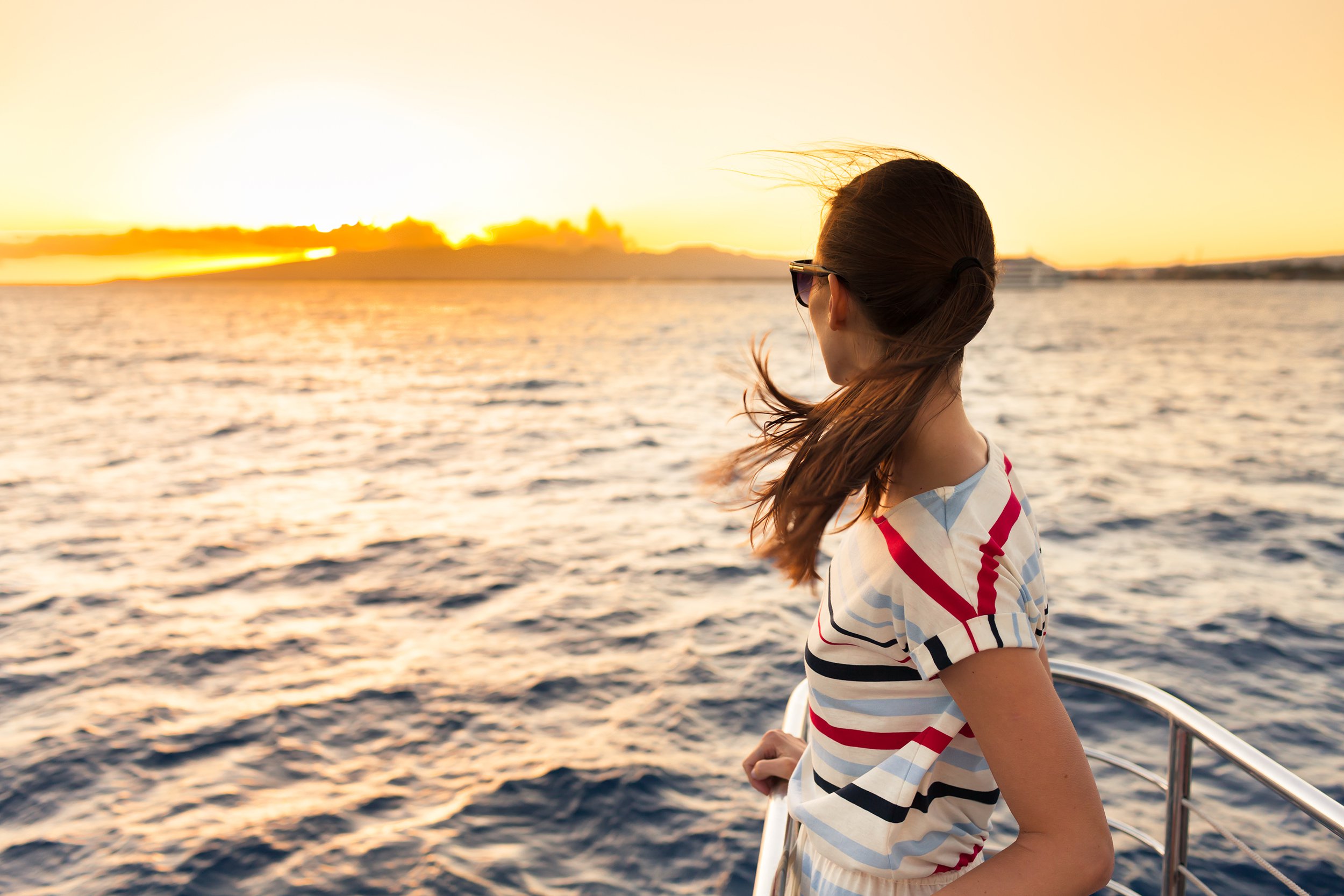 woman on ferry ship out at sea
