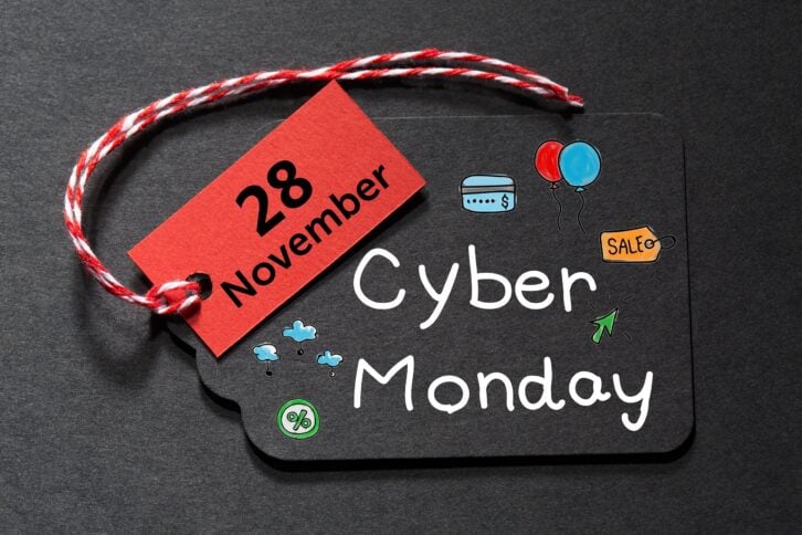 'Cyber Monday' text on a black tag with red and white twine