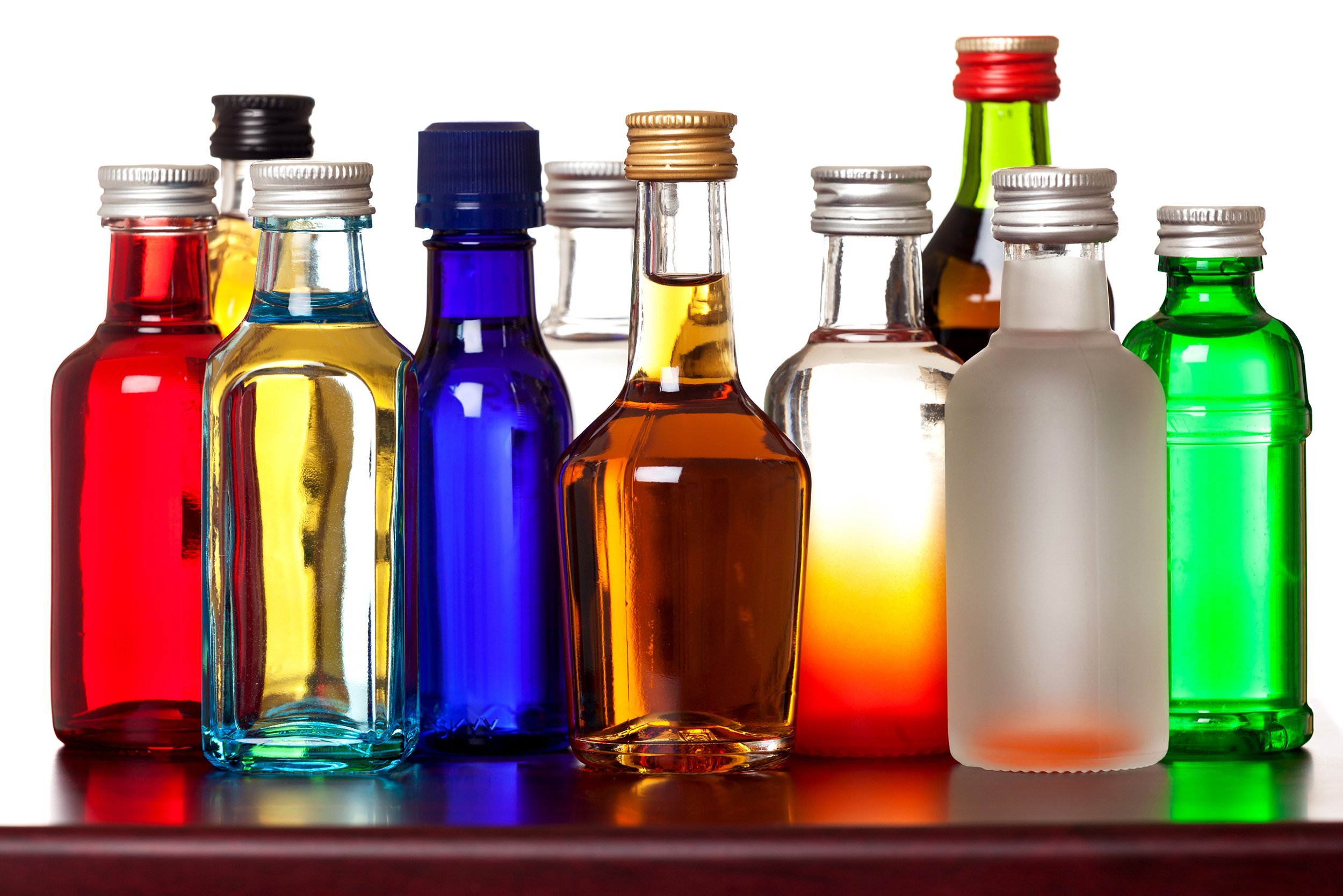 group of colorful spirit little bottles