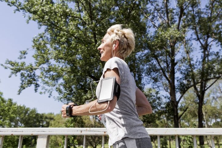 Senior woman jogging in park