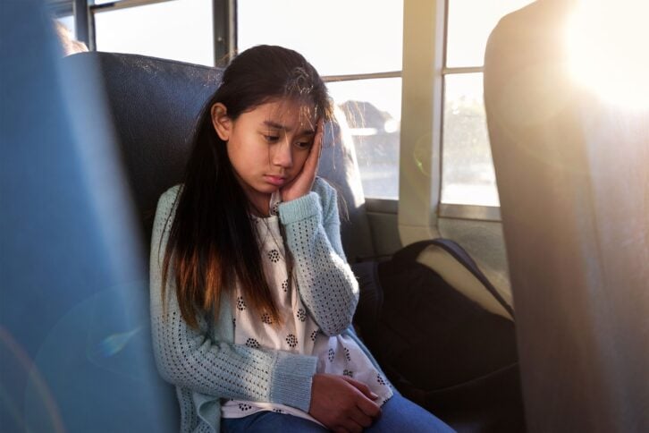 Sick girl on a school bus