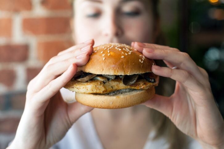 woman eating a burger