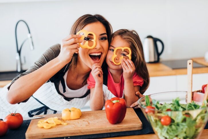 mother and daughter having fun in the kitchen