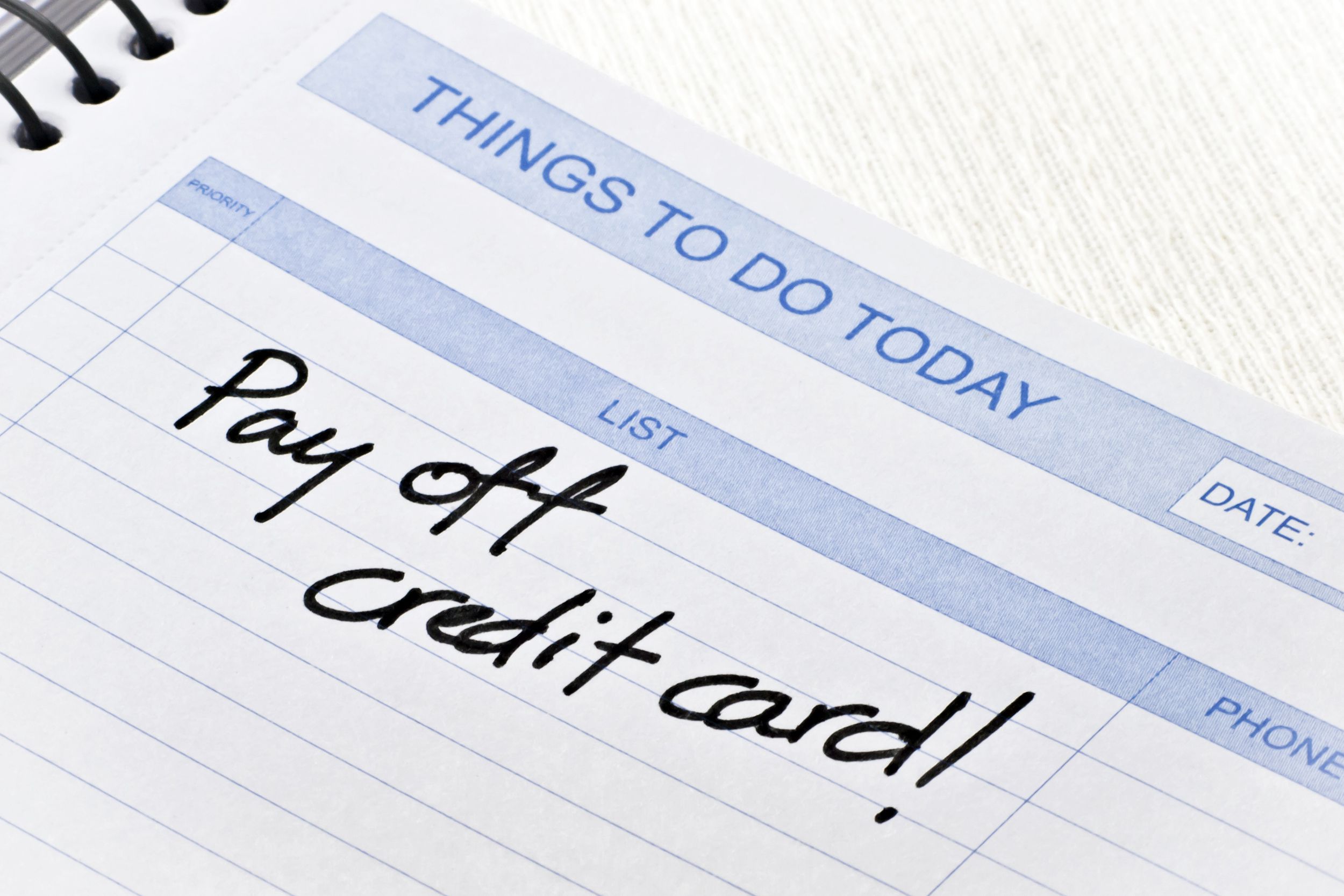 things to do today notepad with pay off credit card! written in black pen