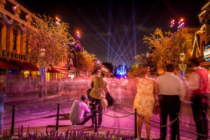 Disneyland castle with people walking