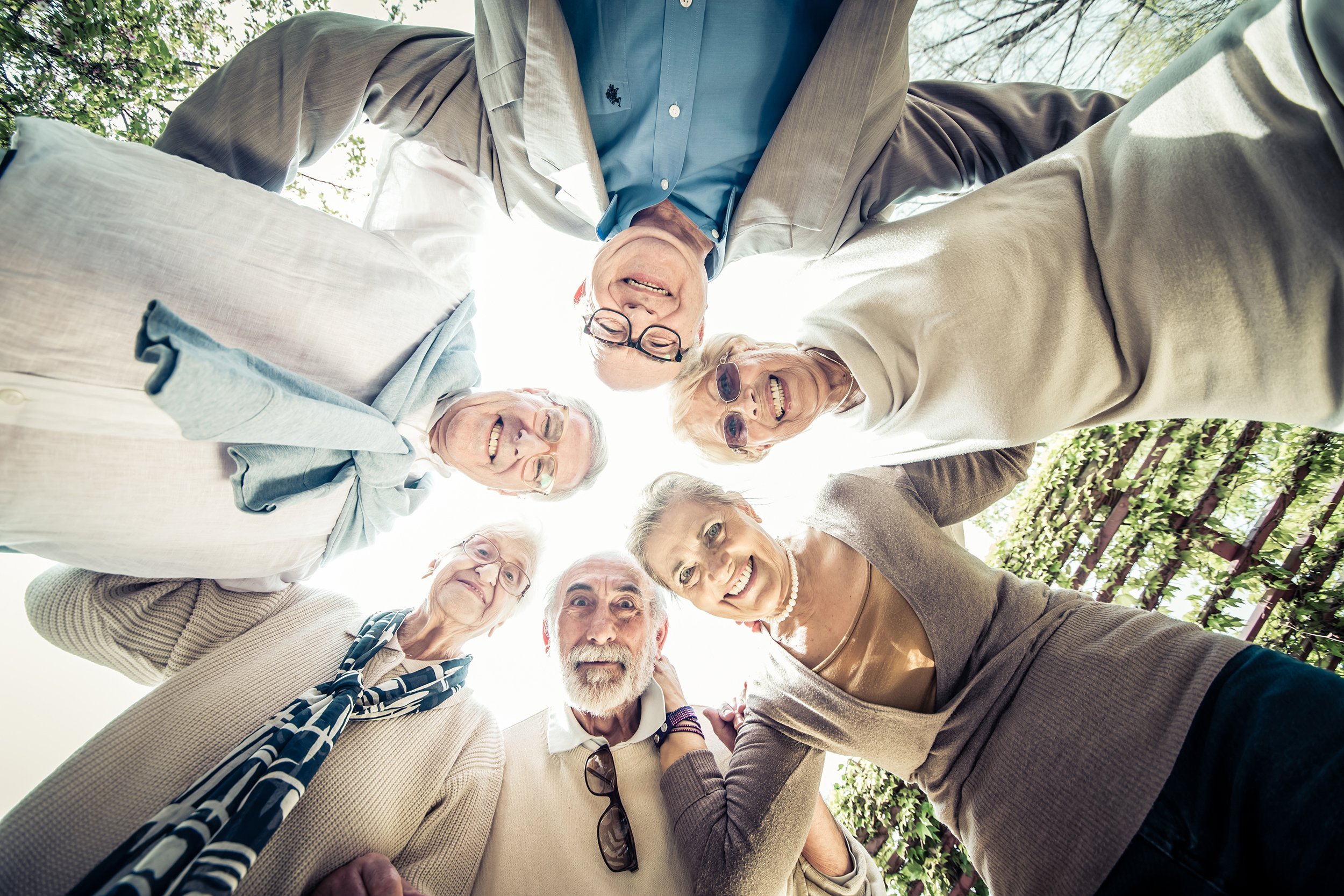 group of senior people in a circle outdoors