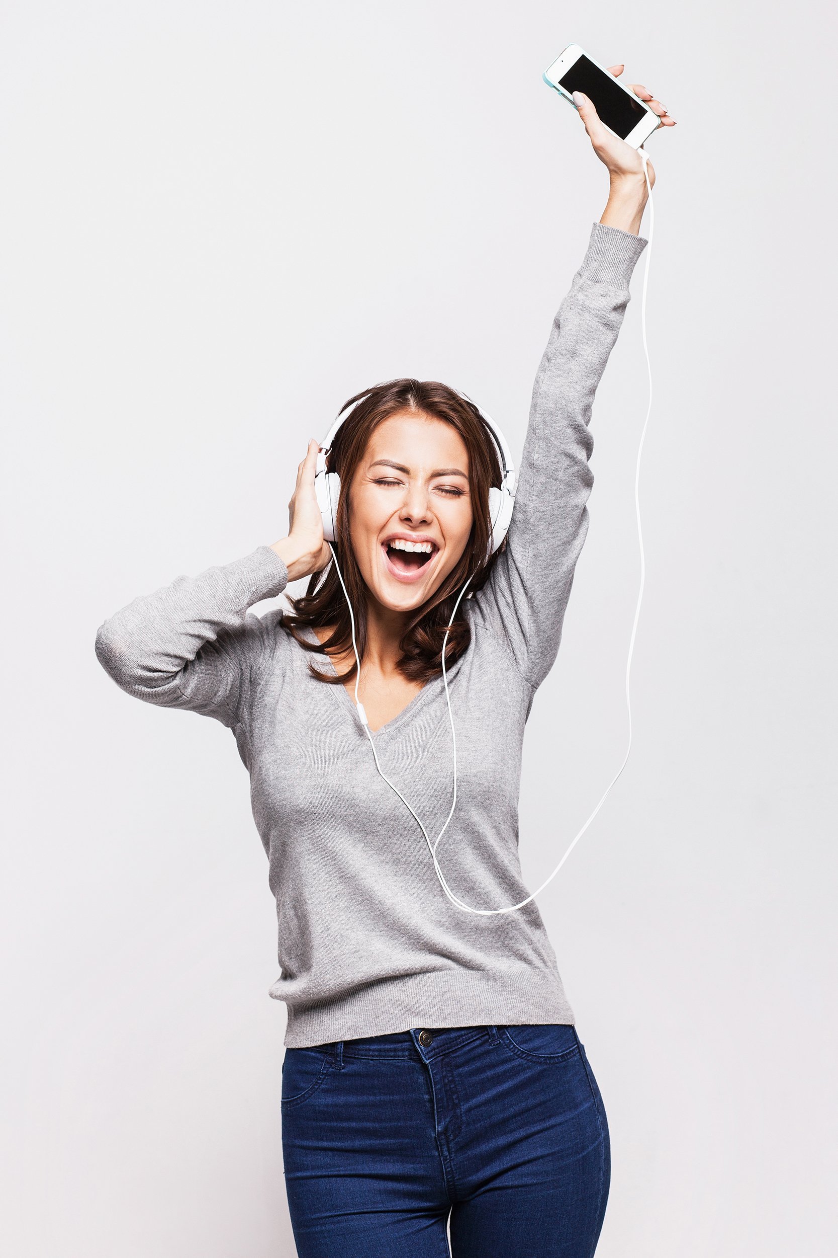 happy woman with headphones listening to music