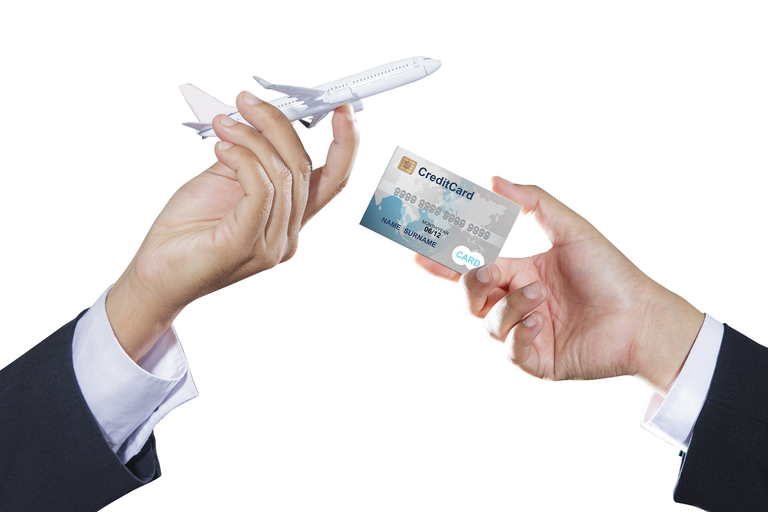 airplane and credit card on businessman hand