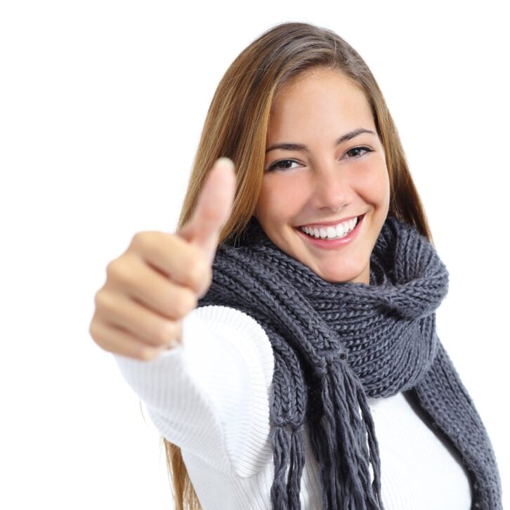 wrapped up woman happy in winter