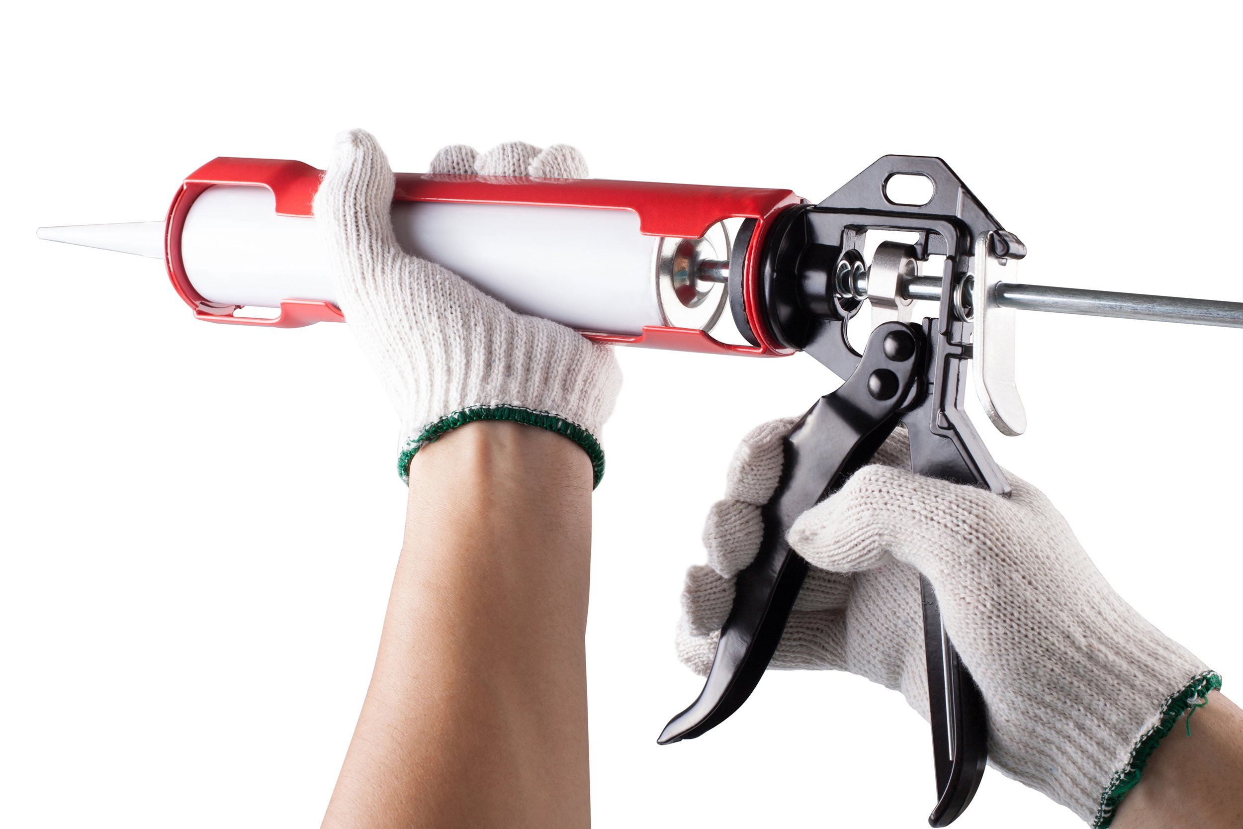 worker applies silicone caulk gun