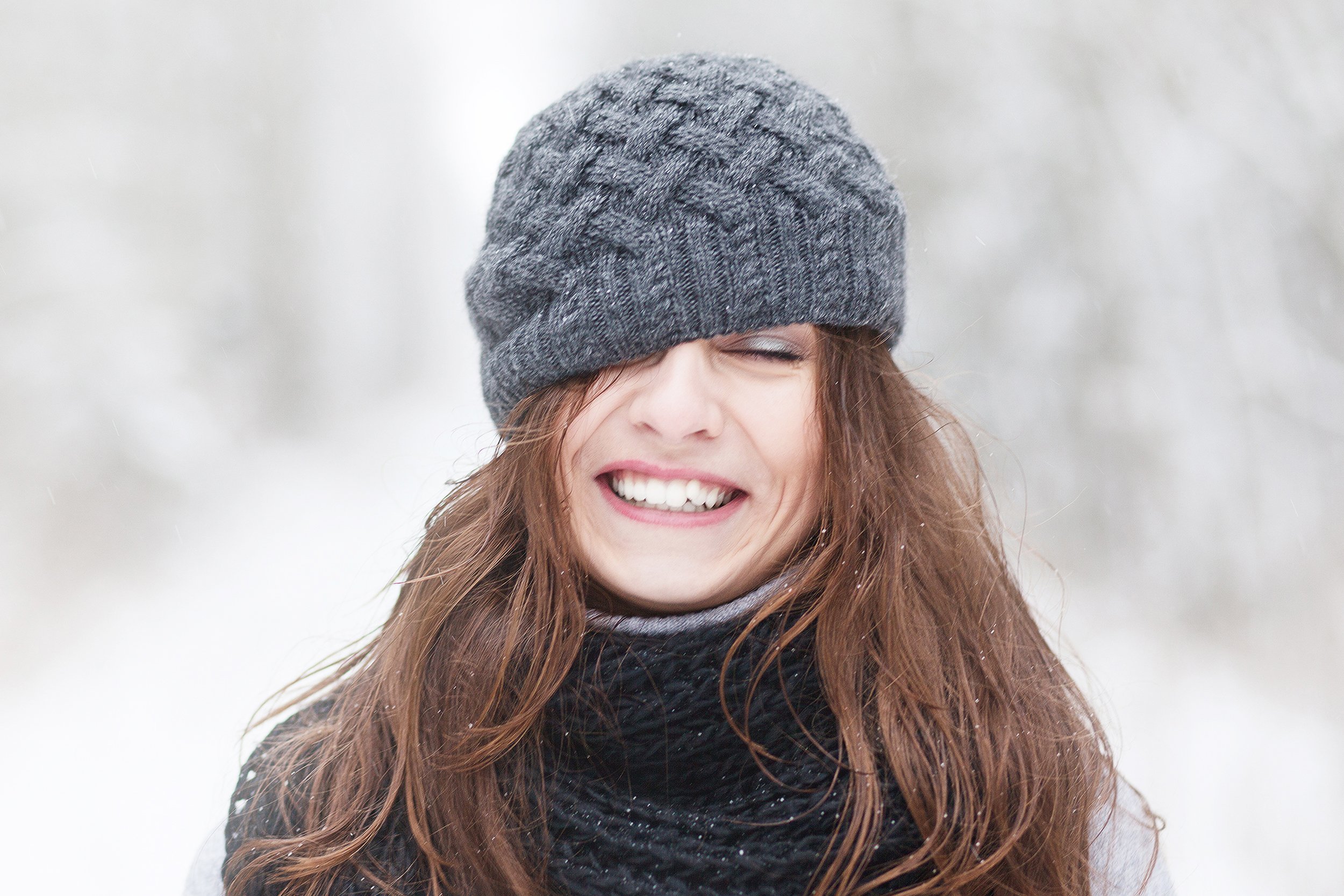 woman outside in the winter in a hat