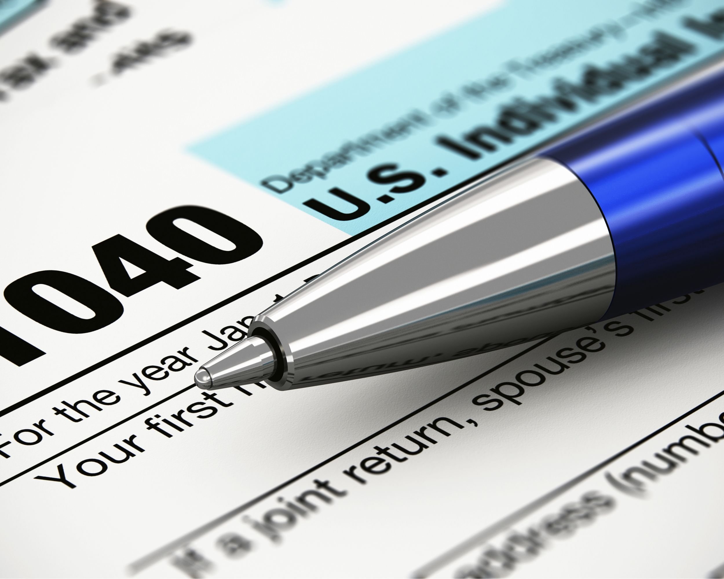 tax form with pen