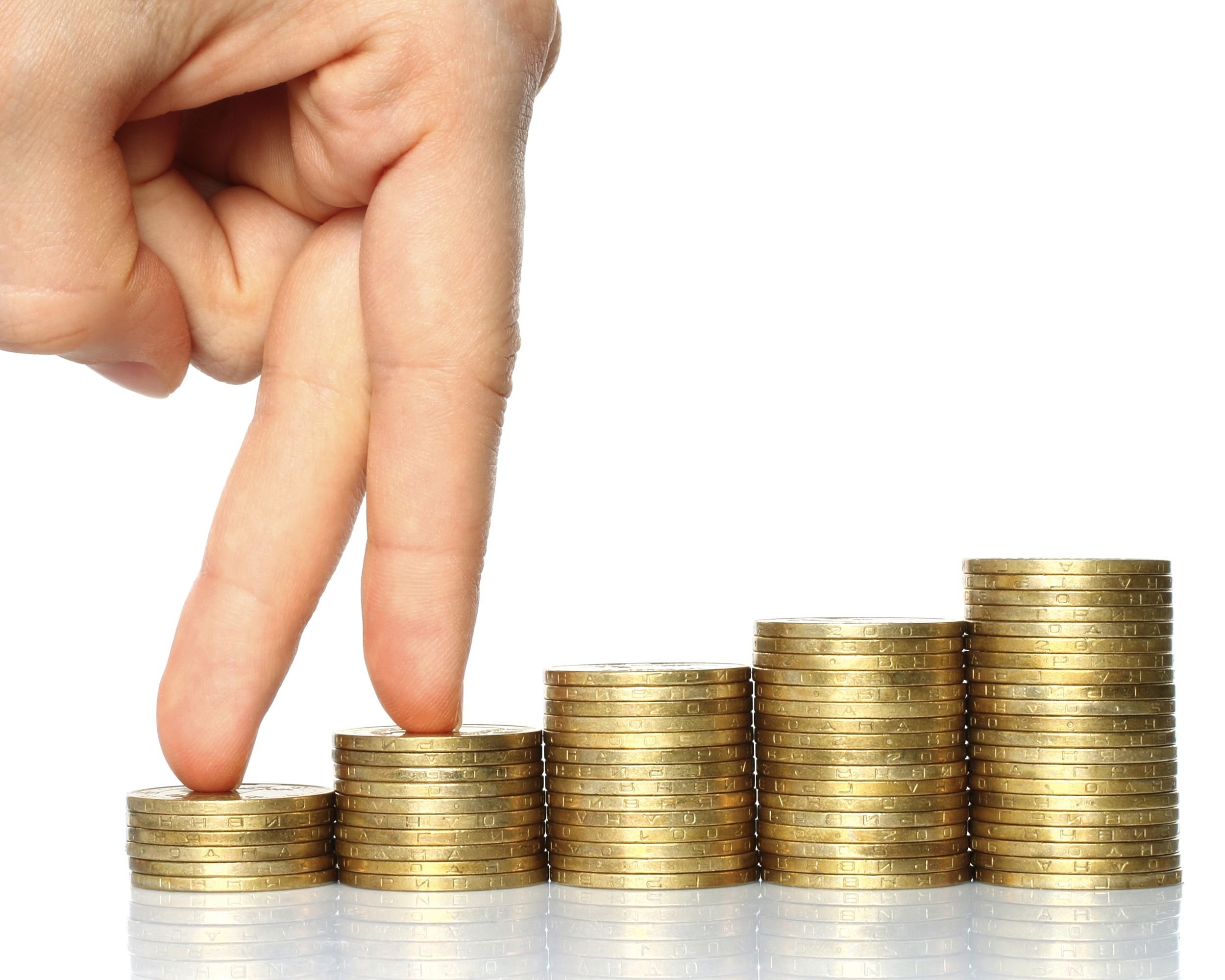 fingers walking up on stacks of coins
