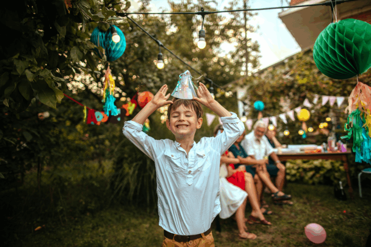 Boy at his birthday party smiling