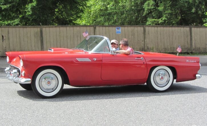 Red 1955 Ford Thunderbird with American flags
