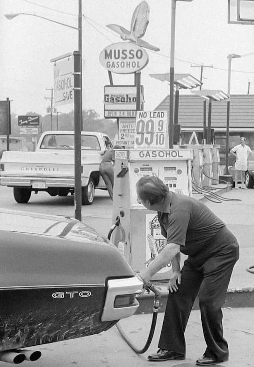 1970s Gas Station Man Pumping Gas