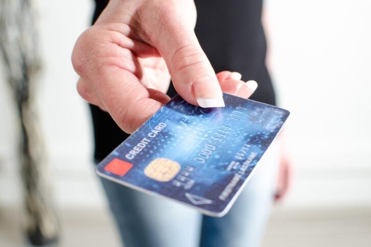 woman hand showing credit card, closeup