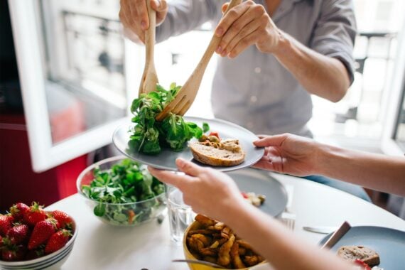 Serving salad on a plate for lunch