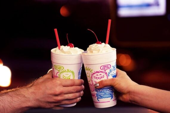 two people with sonic milkshakes in hand