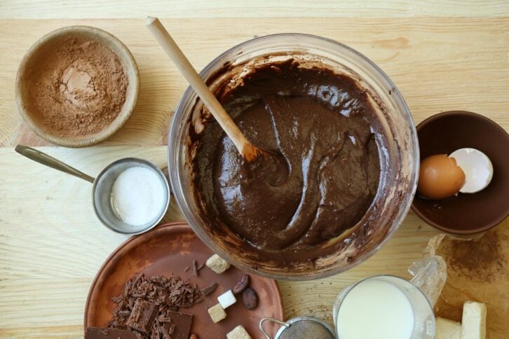 preparing dough for chocolate pie on table