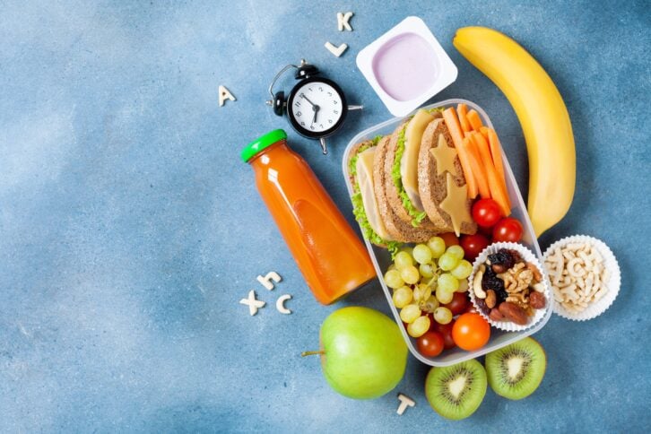 Lunch box with vegetables, fruits and sandwich for school
