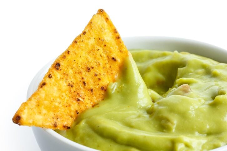 tortilla chip in guacamole