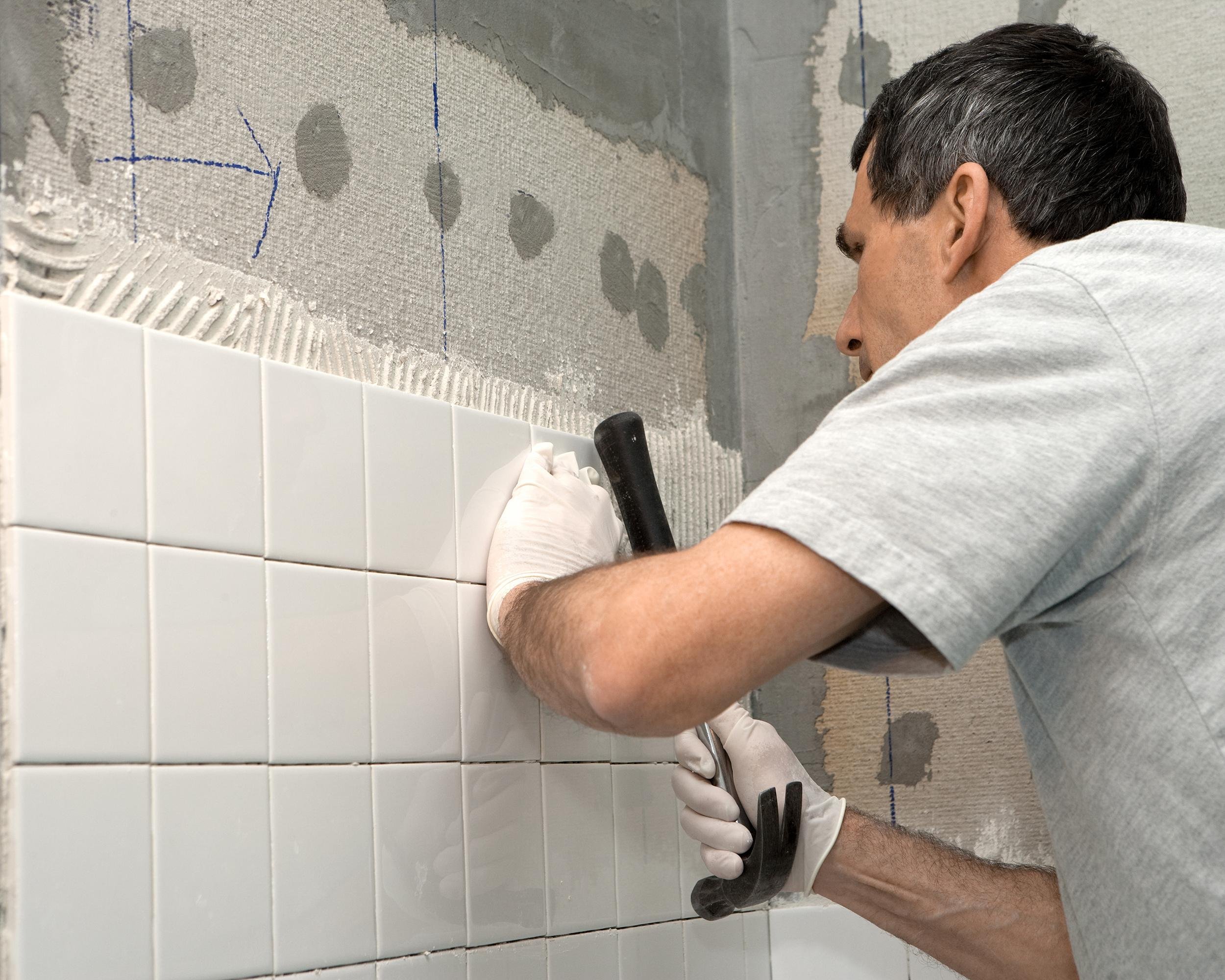 man fixing up bathroom