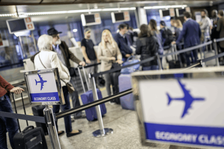 Airline passengers waiting in line