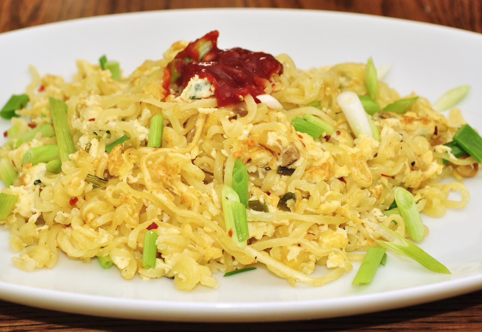 Mmm... breakfast ramen with eggs and red pepper flakes and Sriracha