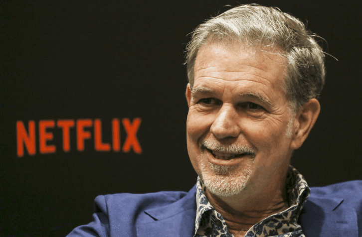 Closeup of Reed Hastings speaking during an interview at Netflix See What's Next: Asia event at the Marina Bay Sands, Singapore, 2018, black background