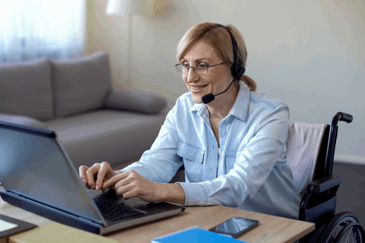 Woman working on her laptop with a headset