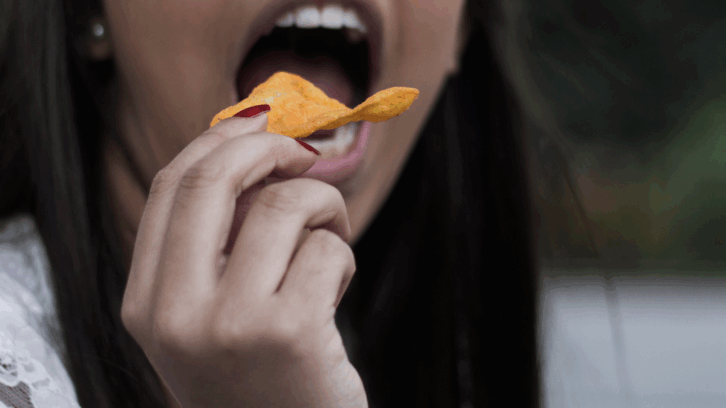 Eating a Doritos chip