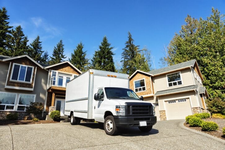 Moving truck in front of house