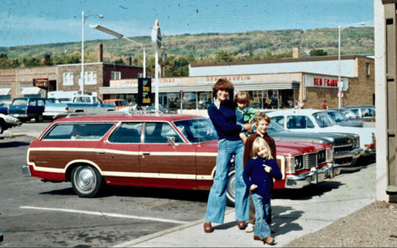 A mom and her kids in front of their station wagon in Grand Marais, Minnesota, 1975. Ford LTD Country Squire