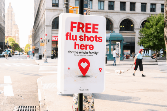'Free Flu Shots Here' sign on a light post in the East Village, Manhattan, 2020, on a sunny day in early autumn
