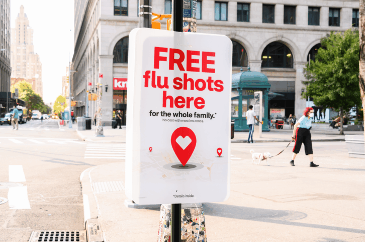 'Free Flu Shots Here' sign on a light post in the East Village, Manhattan, 2020, on a sunny day in early autumn