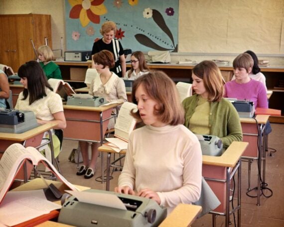 ALL GIRL HIGH SCHOOL TYPING CLASS TYPEWRITERS DESKS TYPING TEACHER WOMAN FUTURE SECRETARIES SEXIST GENDER BIAS