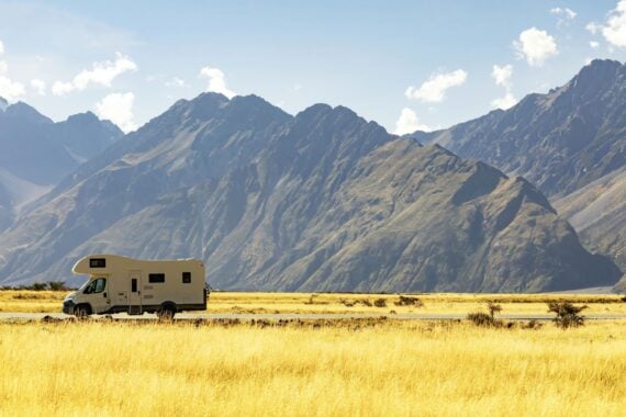 rv On Road Against Mountains