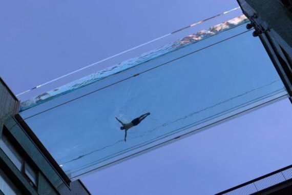 A swimmer takes part in a photoshoot to advertise the new 'sky pool' near Embassy Gardens in south-west London.