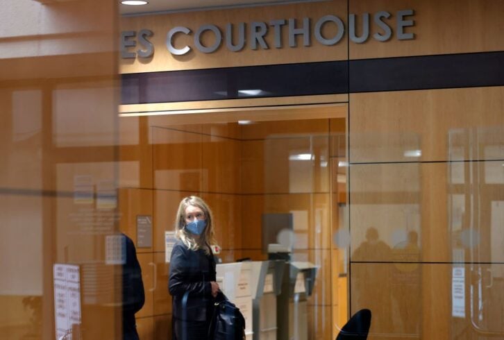 Theranos founder and former CEO Elizabeth Holmes goes through a security checkpoint as she arrives for her trial at the Robert F. Peckham Federal Building on November 17, 2021 in San Jose, California.