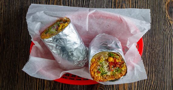 Burrito cut in half on a table