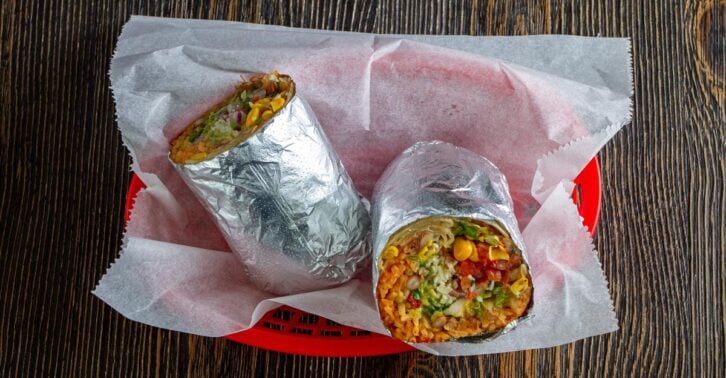 Burrito cut in half on a table