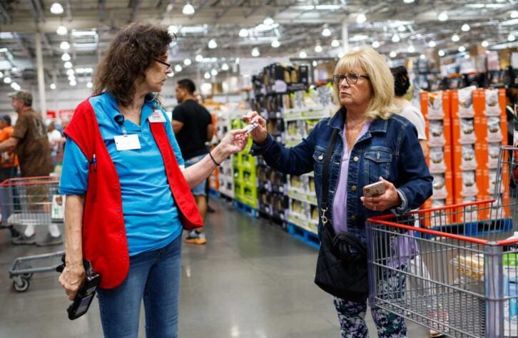 A staff speaks to a customer inside a Costco store on June 28, 2023 in Teterboro, New Jersey. Costco is cracking down on membership card sharing at its stores.