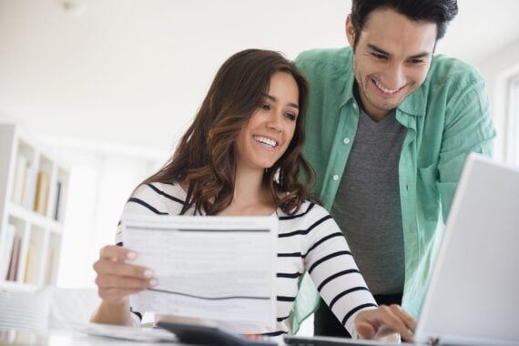 couple paying bills together online