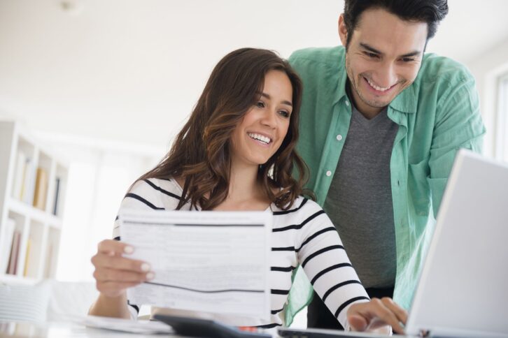 couple paying bills together online