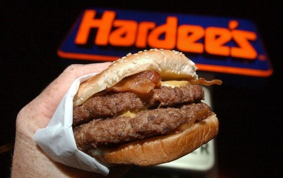 A Hardee's Monster Thickburger at a restaurant in Columbus, Georgia on November 17, 2004. The newly introduced hamburger is 2/3 of a pound of Angus beef and features four strips of crispy bacon, three slices of American cheese, and some mayonnaise on a bu