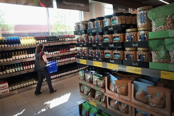 Customers shop at an Aldi grocery store on June 12, 2017 in Chicago, Illinois.