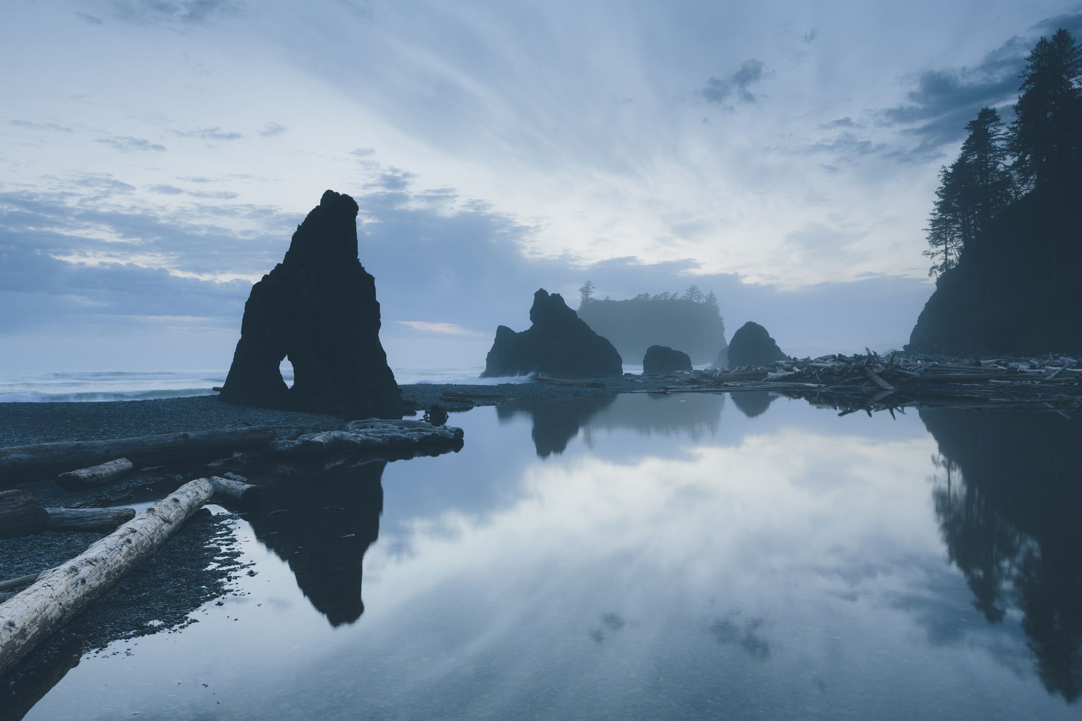 Scenic view of rock formations at Ruby Beach against sky at Olympic National Park