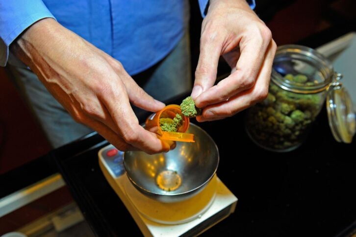tim blakeley, manager of sunset junction medical marijuana dispensary, fills a marijuana prescription on may 11, 2010 in los angeles, california